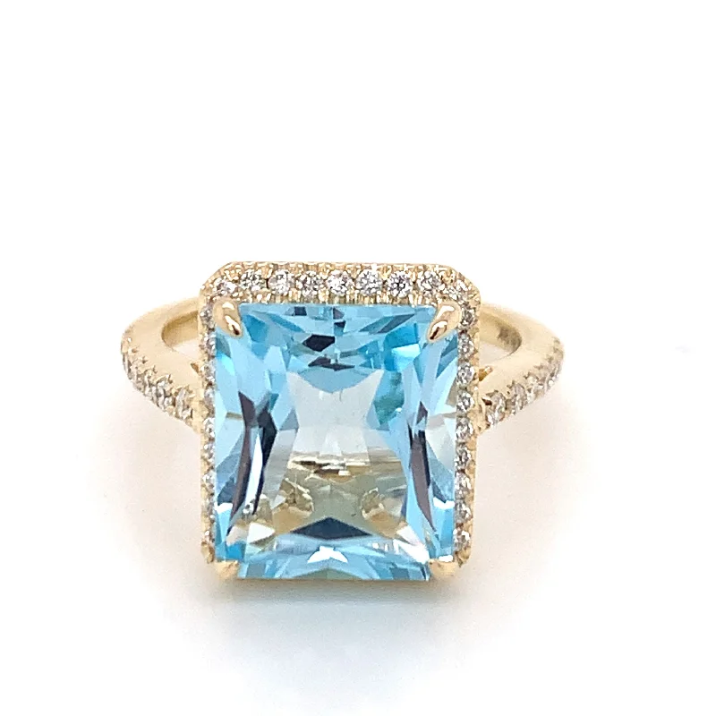 9ct Yellow Gold Emerald Cut Sky Blue Topaz & Diamond Shoulder Halo Ring