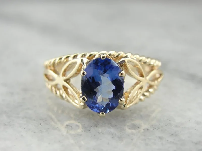 Tanzanite and Yellow Gold Ring with Filigree Trieskel Mounting