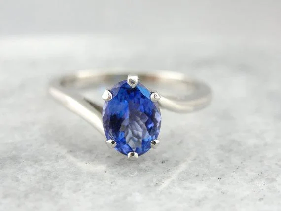 Twisting, Sleek Solitaire and Bright Tanzanite Ring