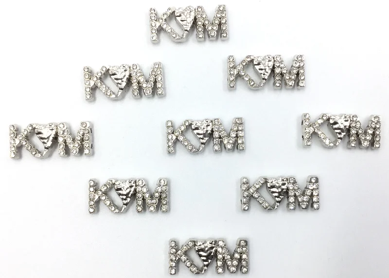 Silver KM Shaped Badge